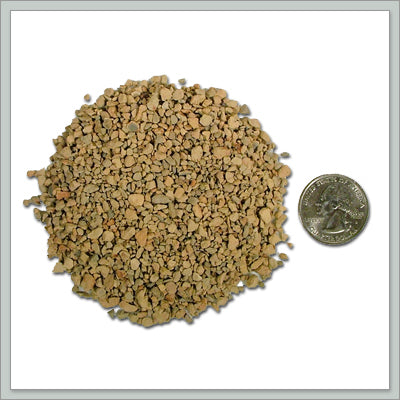 Dry sample of calcined clay with quarter to show size and variation
